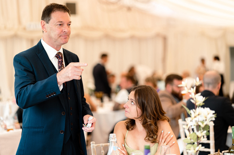 Dave Royal performing close-up magic for guests at an event in Norfolk