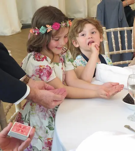 Wedding magician Dave Royal entertaining guests during a reception