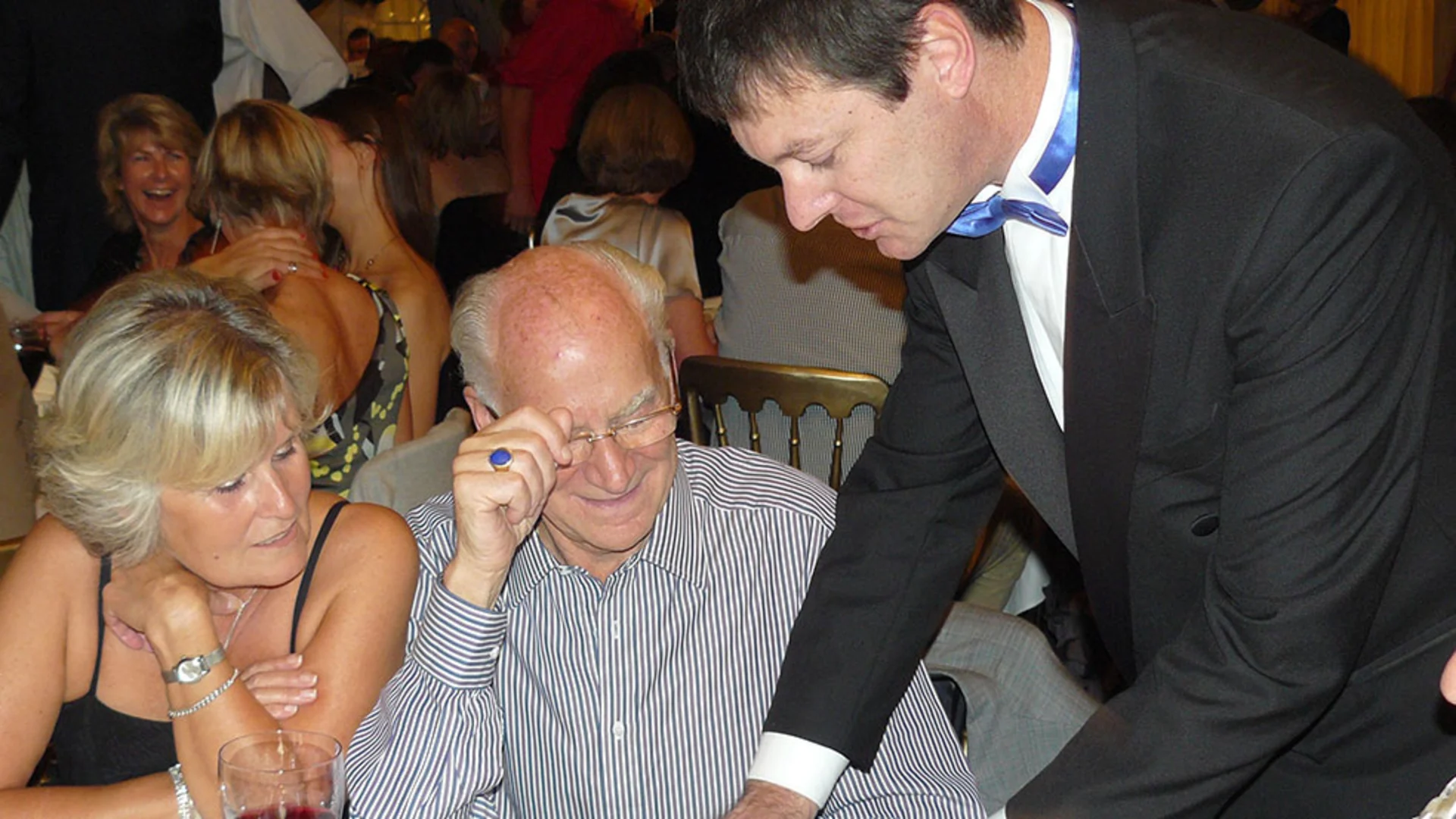 Corporate magician entertaining guests at an event